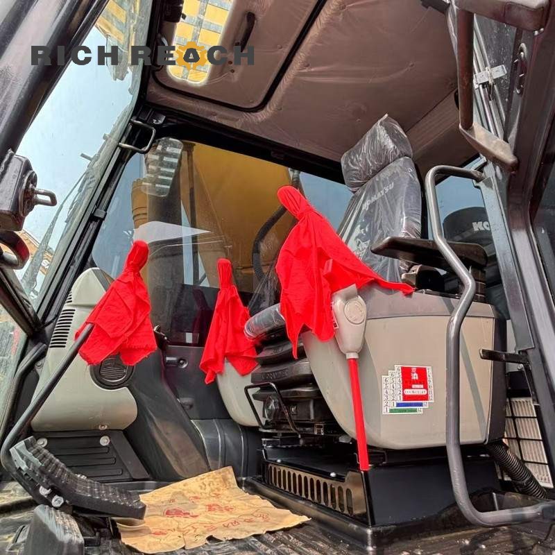 Rear view of a 2018 Komatsu PC240LC excavator, listed for $34,722